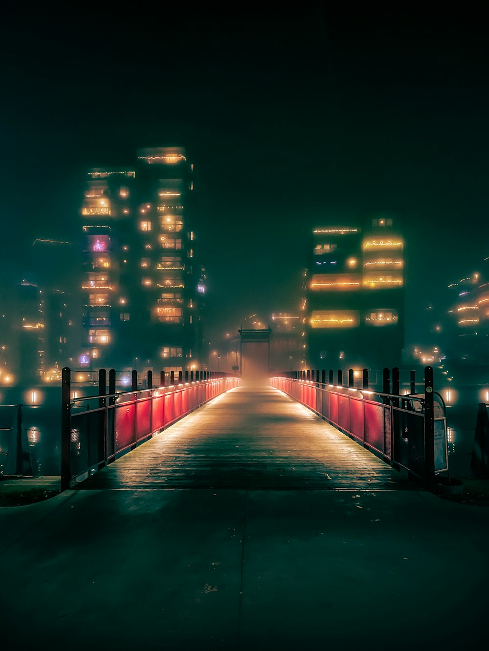 green concrete pathway during night time