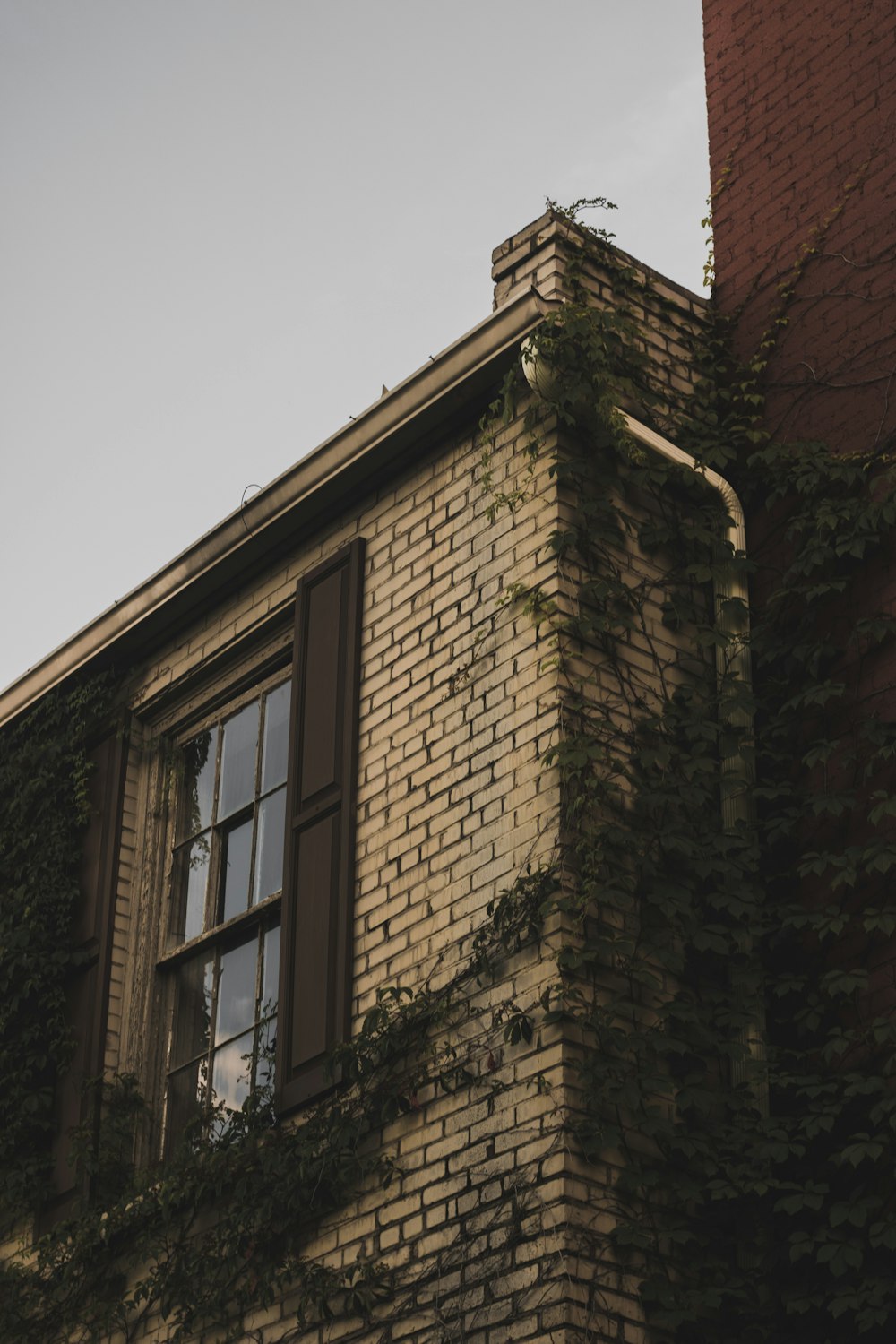 brown brick building under white sky during daytime