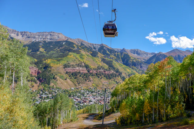 Gondola over forested slopes above Telluride, Colorado