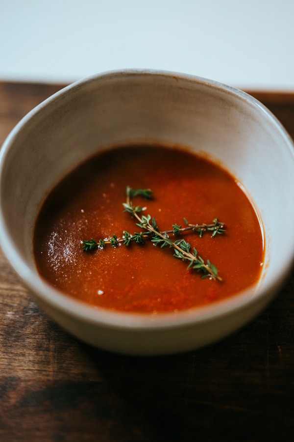Red soup in stainless steel bowl