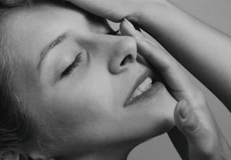 grayscale photo of womans face