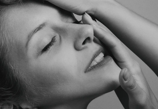 grayscale photo of womans face