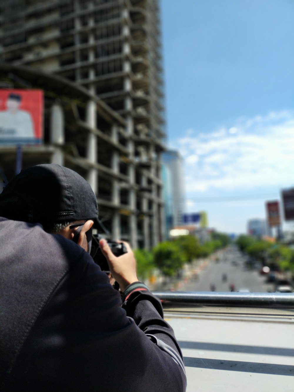 person in black hoodie using smartphone