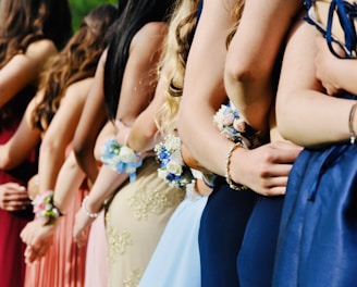 woman in blue sleeveless dress wearing blue and white floral tiara