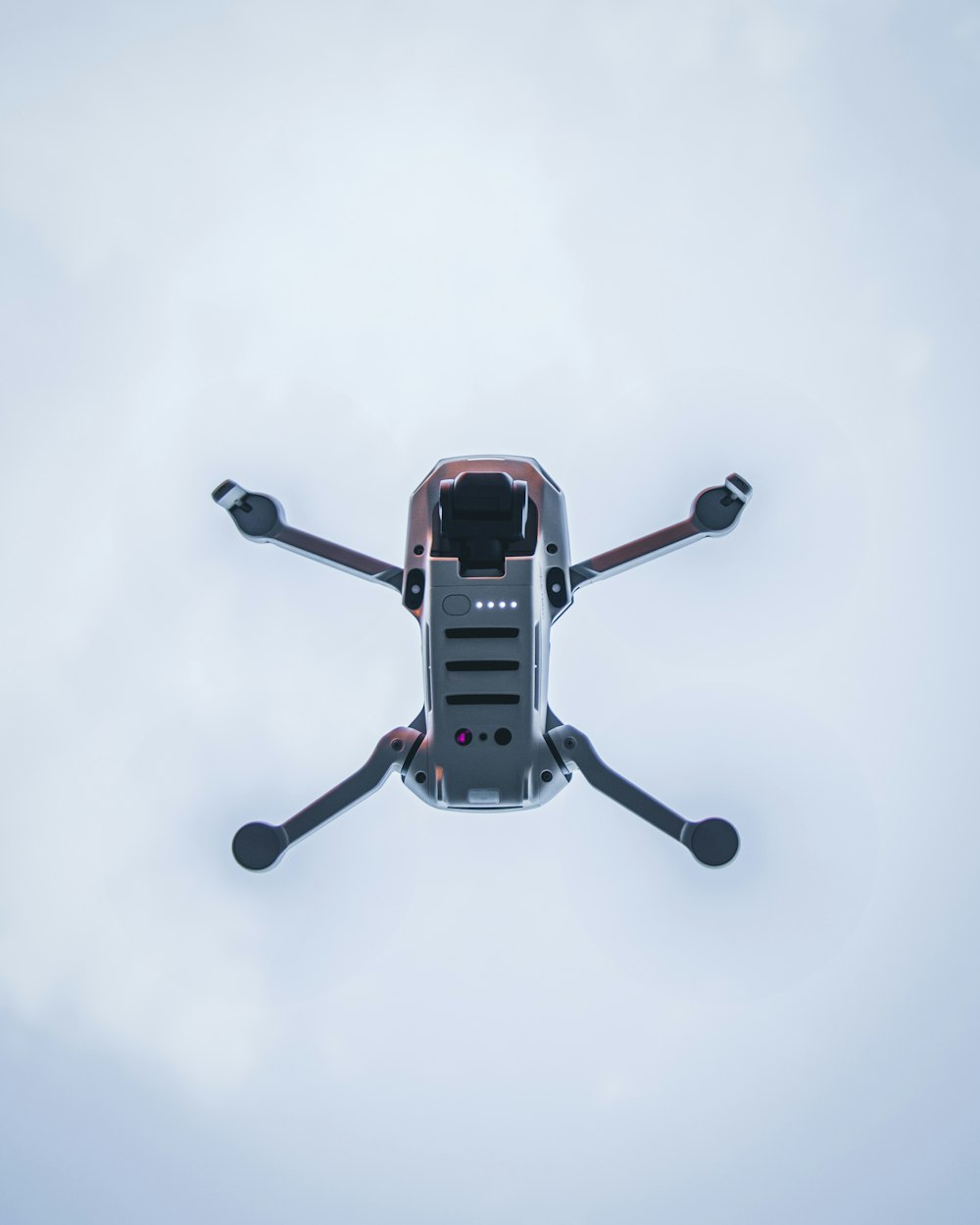 red and black drone in mid air