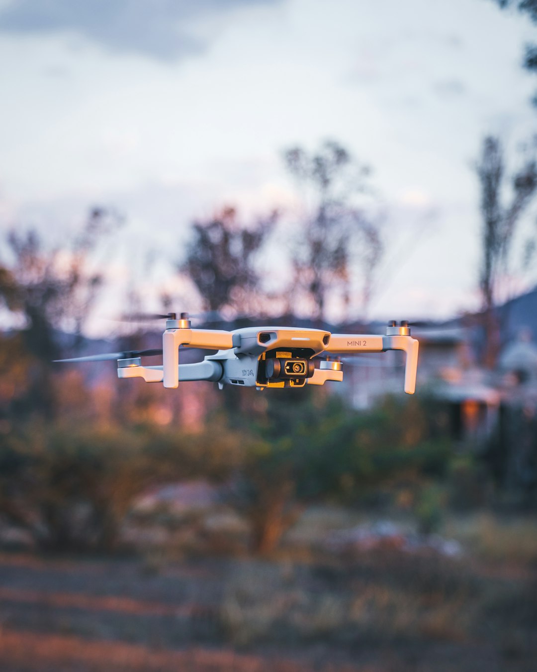 yellow and black drone flying in the air