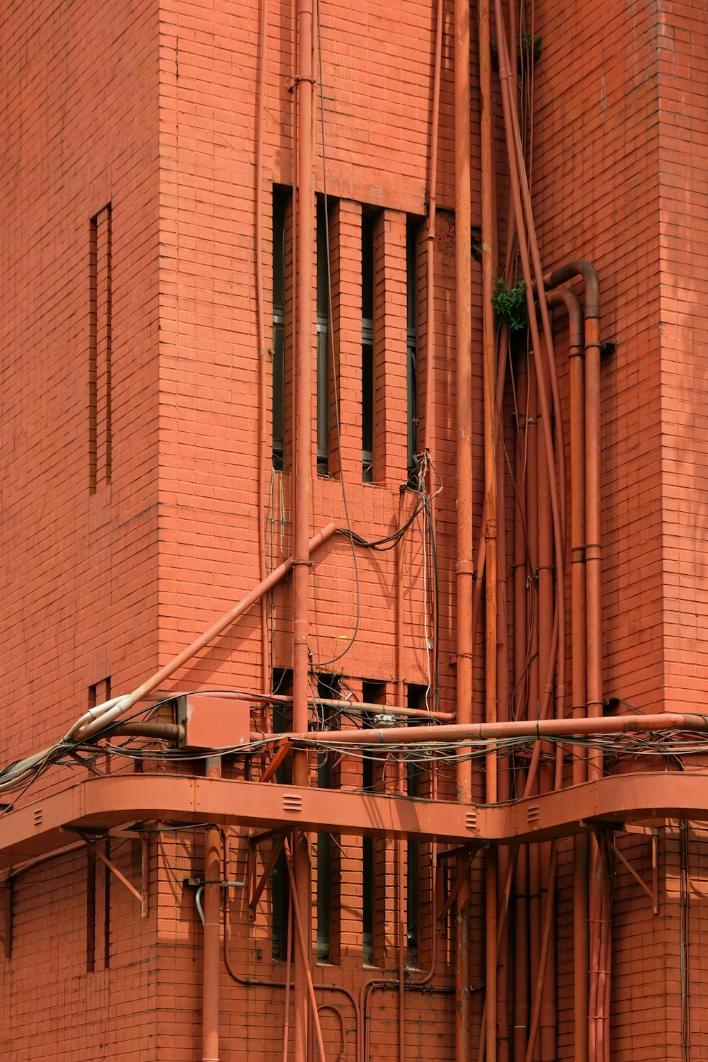 brown brick building with brown metal railings