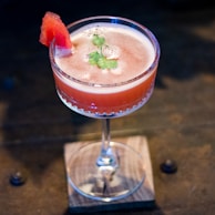 clear drinking glass with red liquid