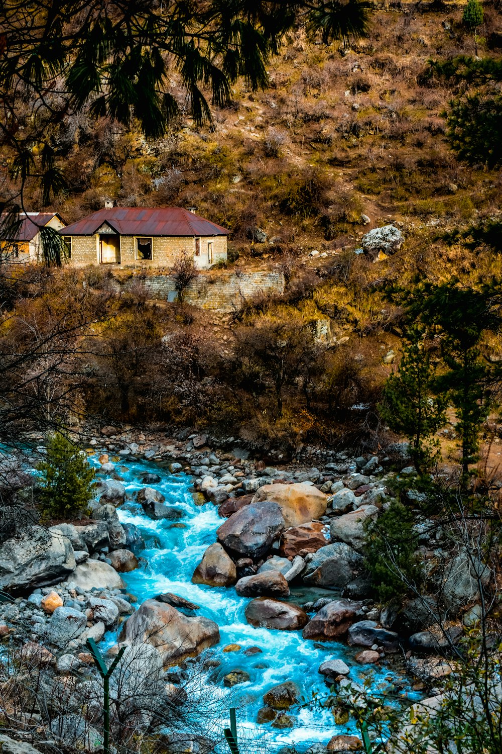 brown brick house near river