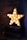 gold star ornament on brown wooden table