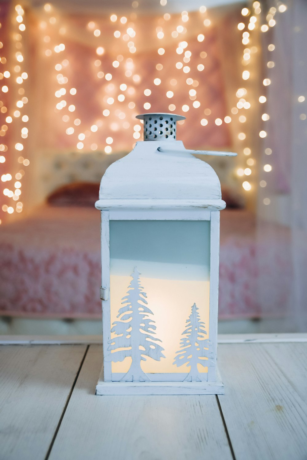 white and black floral candle lantern