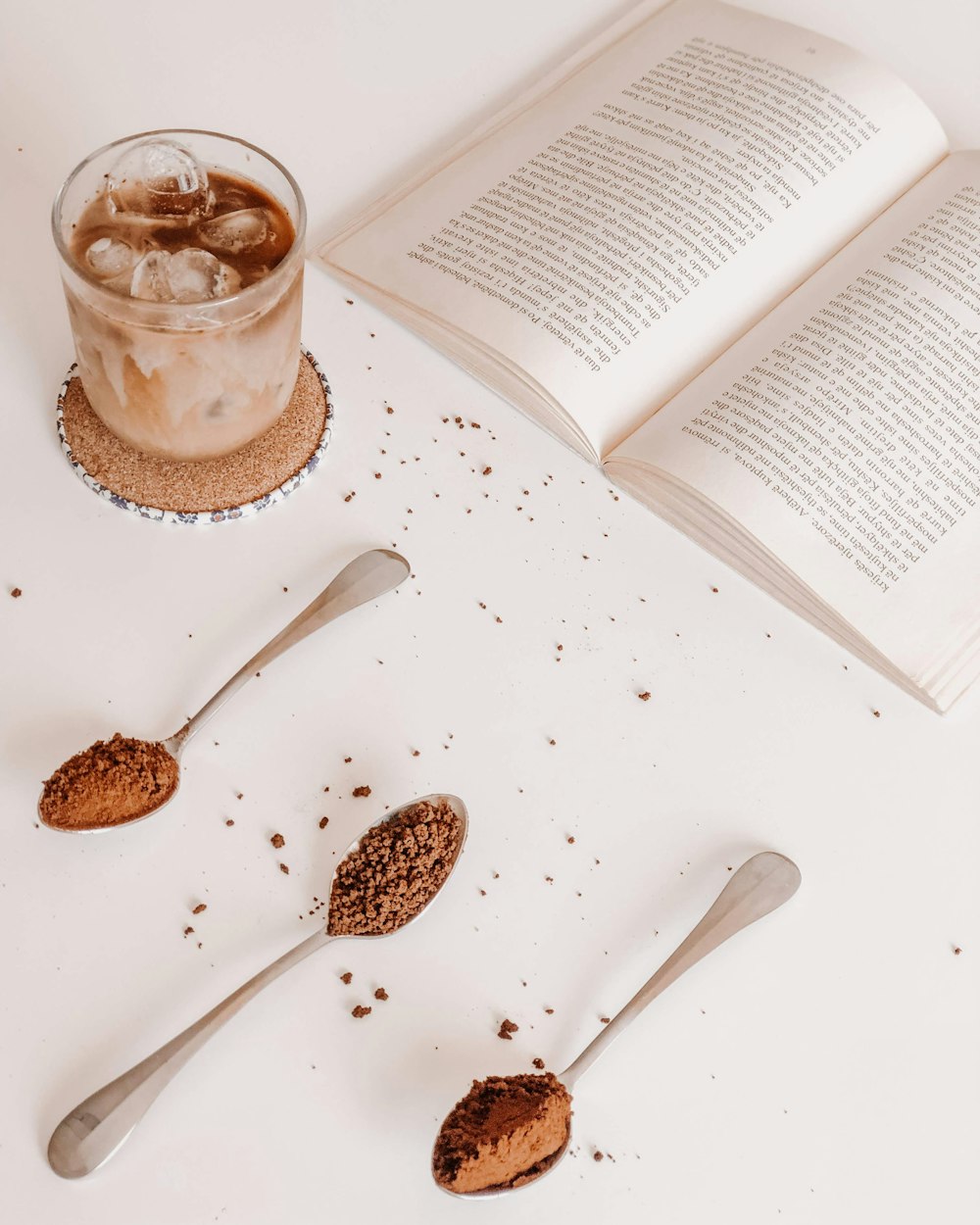 clear glass mug with brown liquid