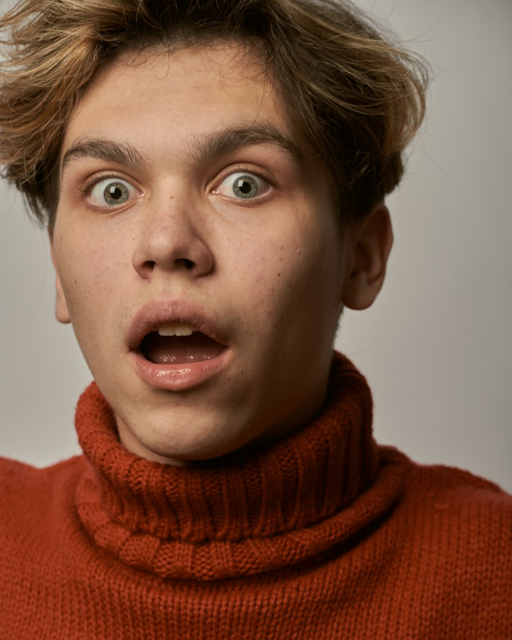 boy in red turtleneck sweater