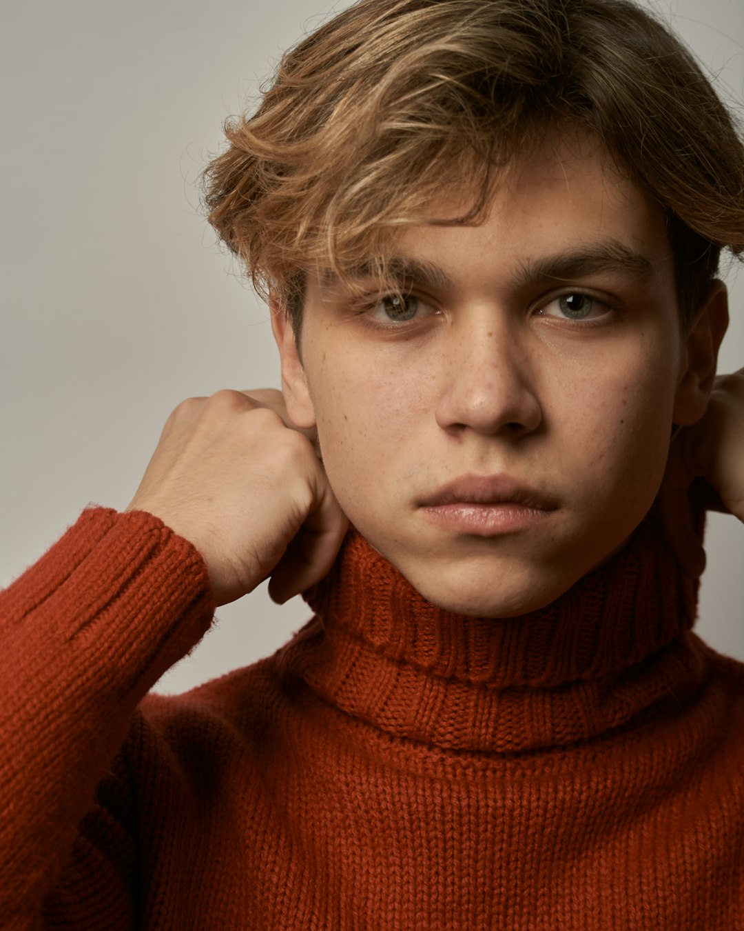 woman in red turtleneck sweater