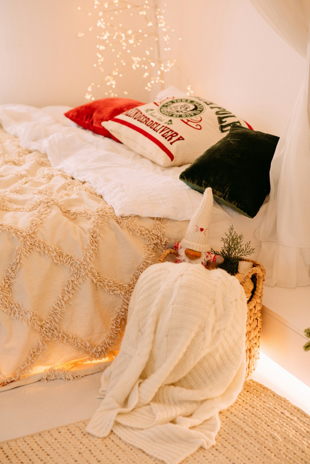 white and red throw pillow on white bed