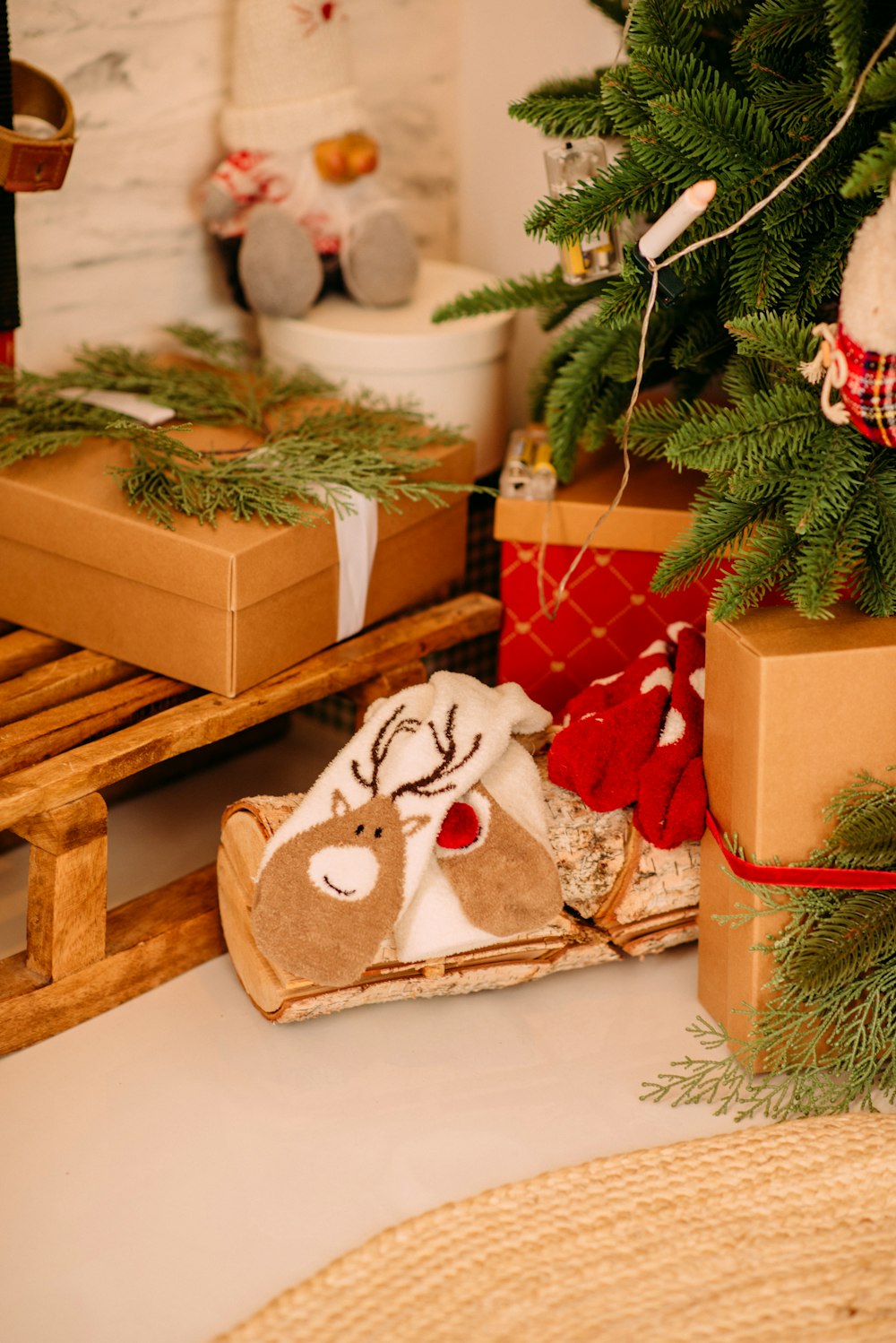 brown and white bear plush toy on brown wooden box