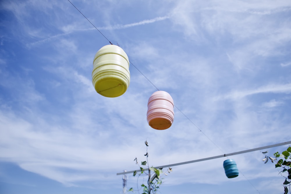 yellow paper lantern under blue sky during daytime