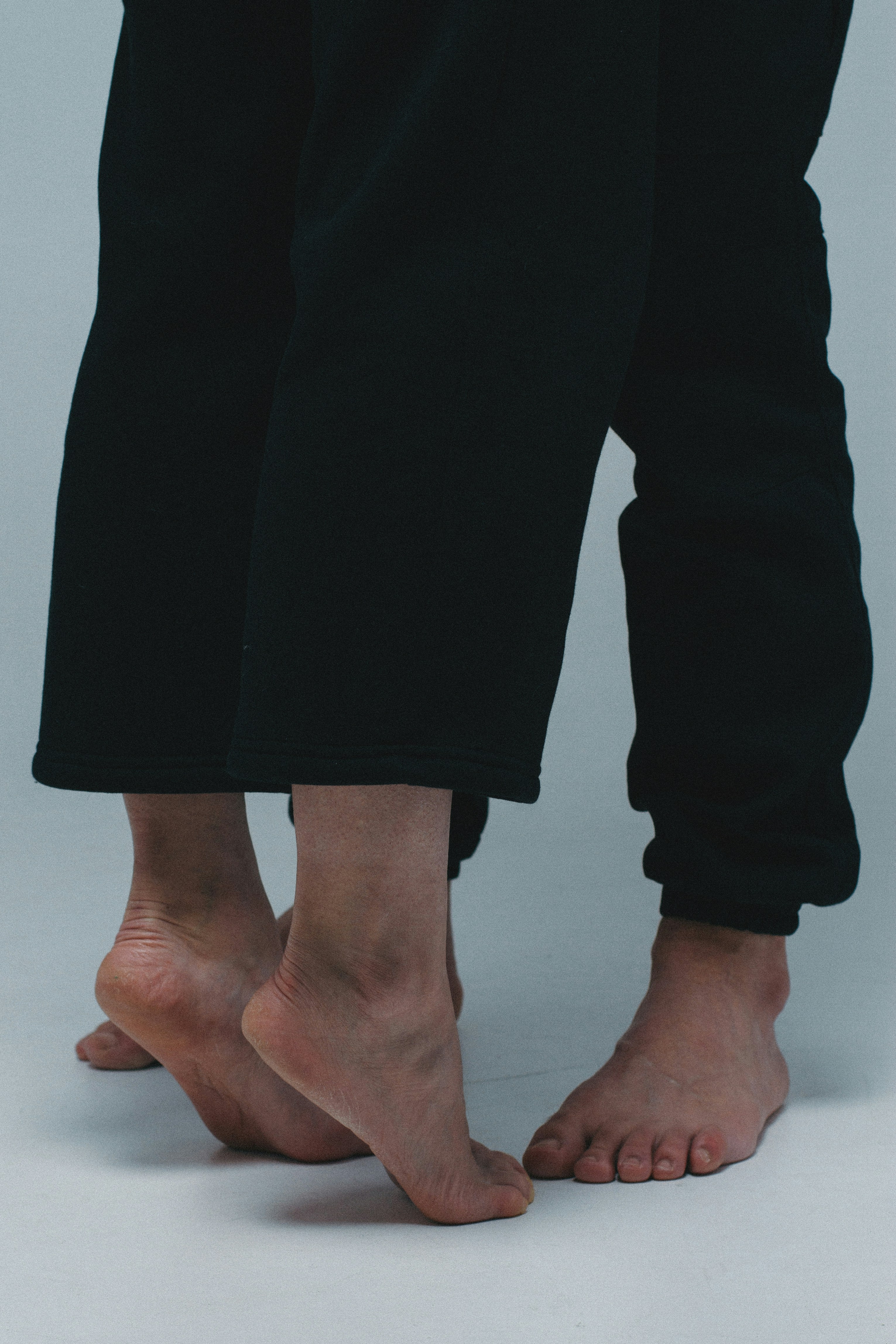 person in black pants standing