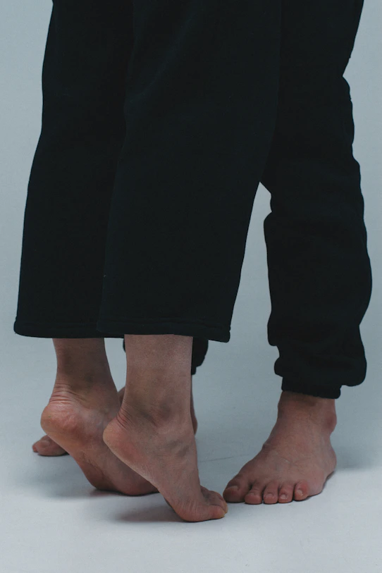 person in black pants standing
