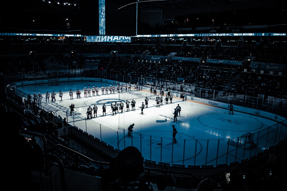 people playing basketball on ice stadium during night time