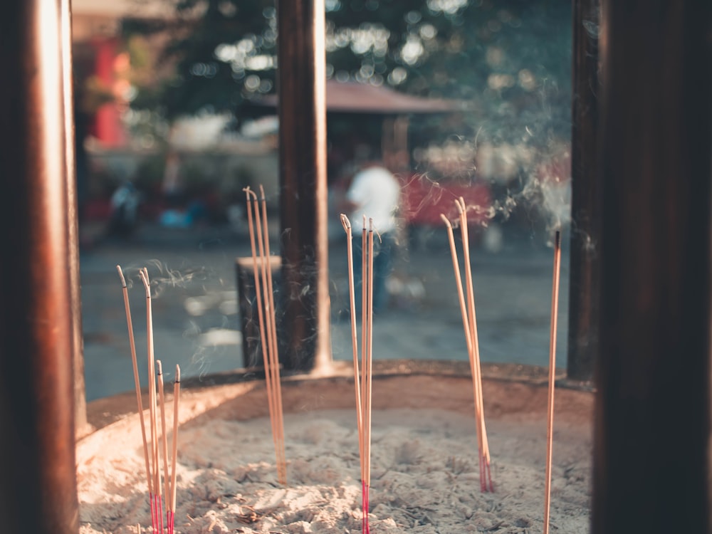 brown wooden stick with white powder