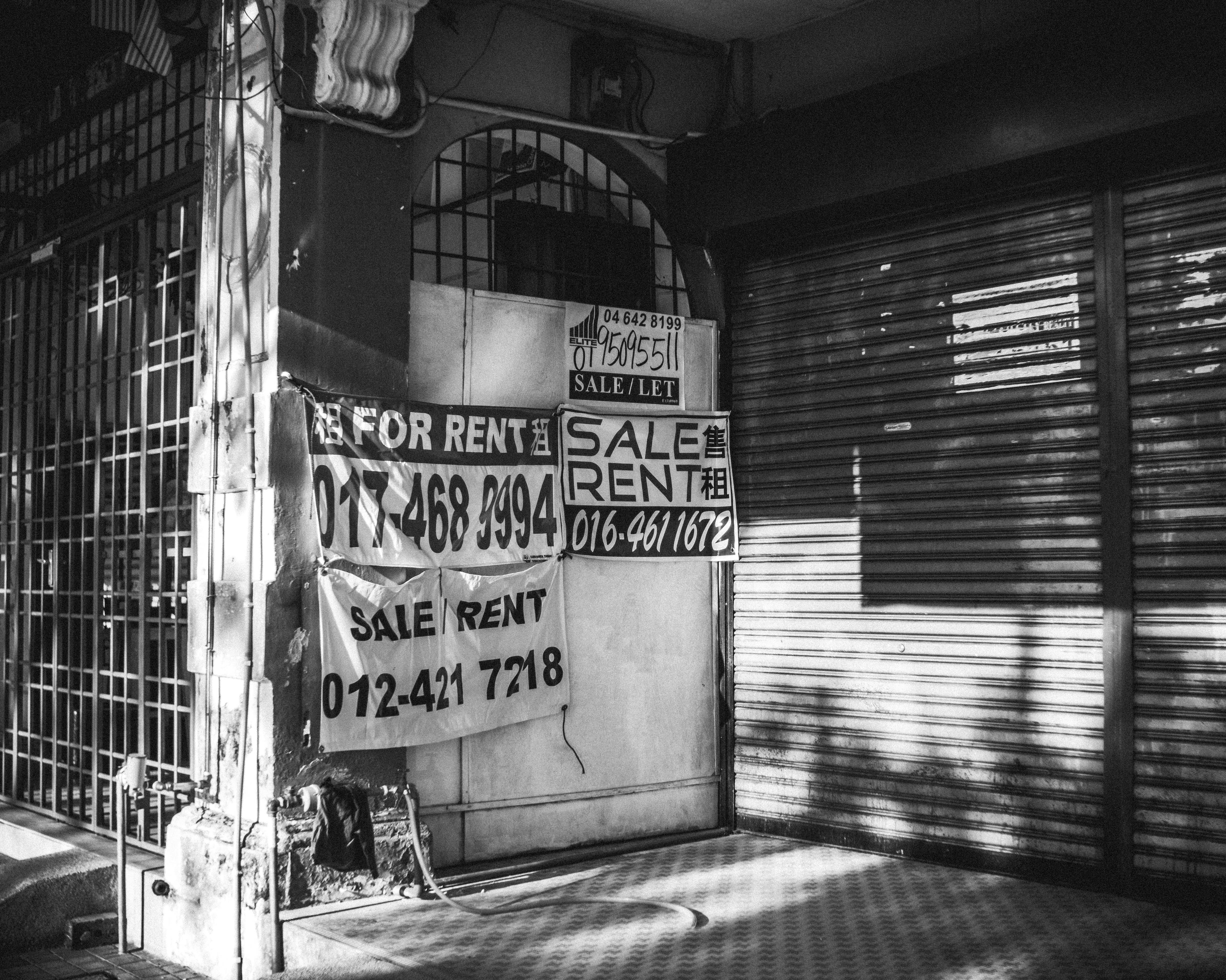 grayscale photo of graffiti on wall
