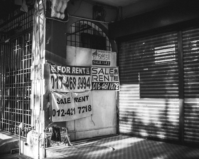 Photo of a cozy local shop with a clear 'For Lease' sign in the window.