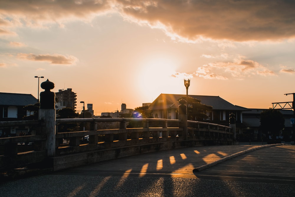 people walking on sidewalk during sunset