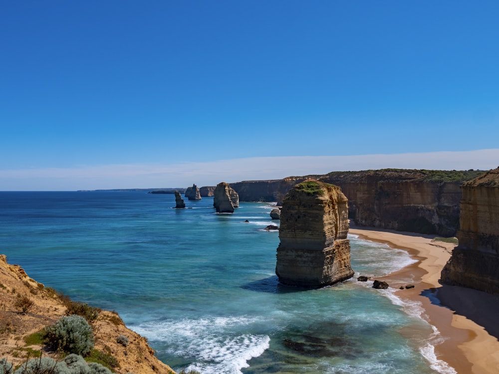 brown rock formation on sea shore during daytime