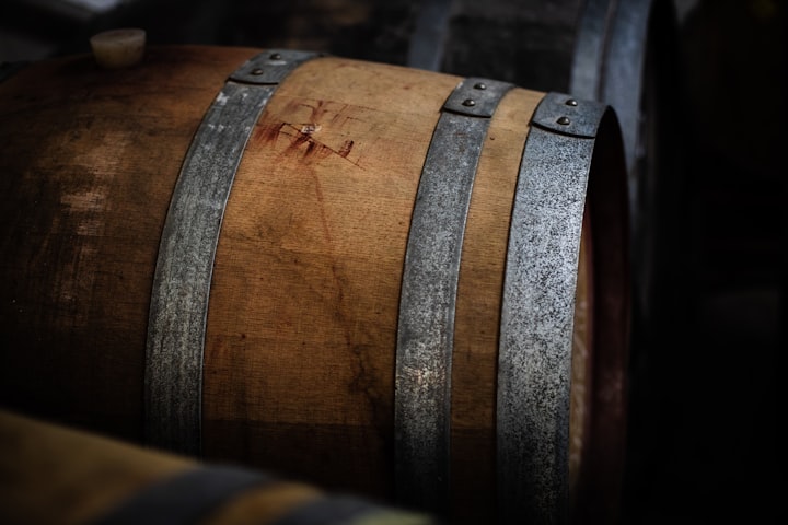 A barrel for wine or whiskey. Photo by Charl Folscher / Unsplash