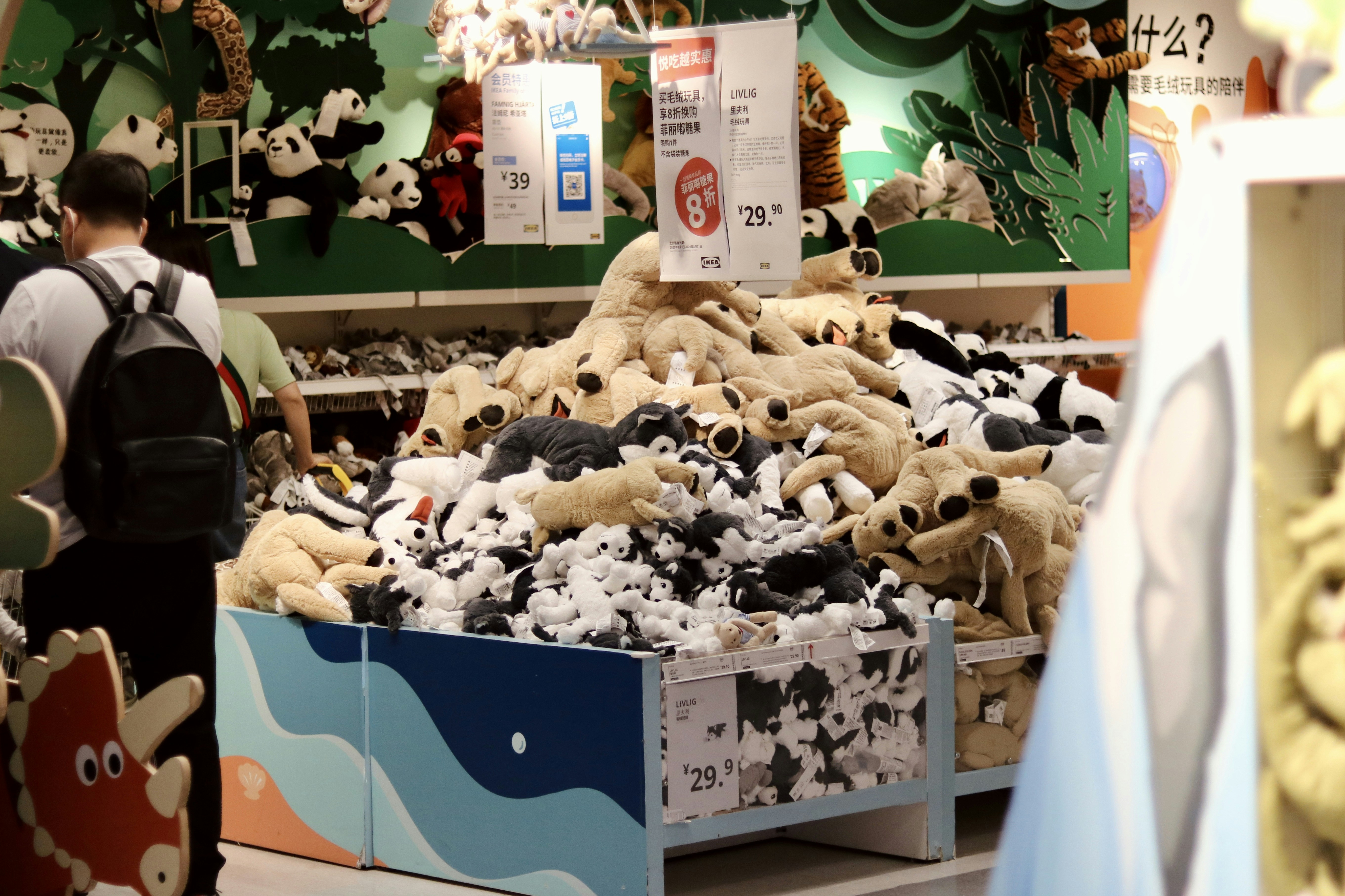 a pile of stuffed animals in a store