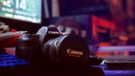 black nikon dslr camera on table