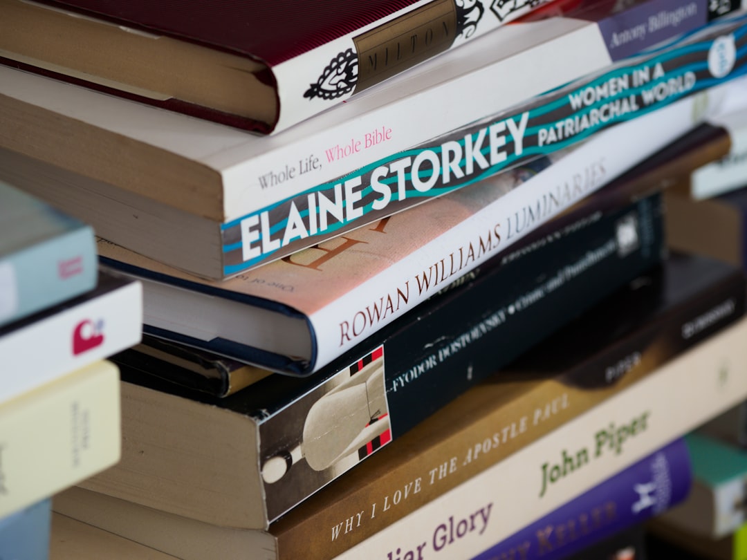 books on brown wooden shelf