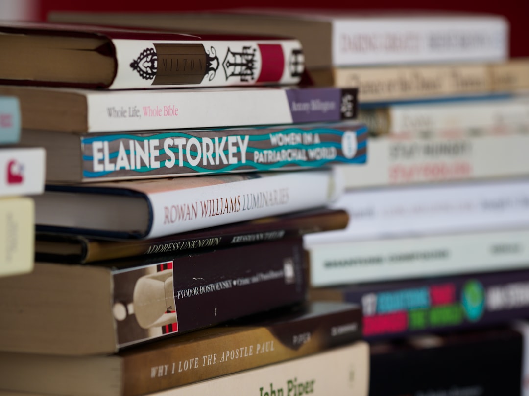 books on brown wooden shelf