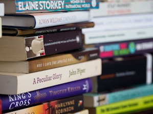 books on white wooden shelf