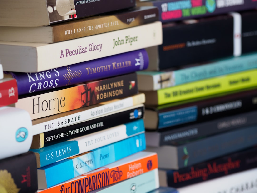 books on white wooden shelf