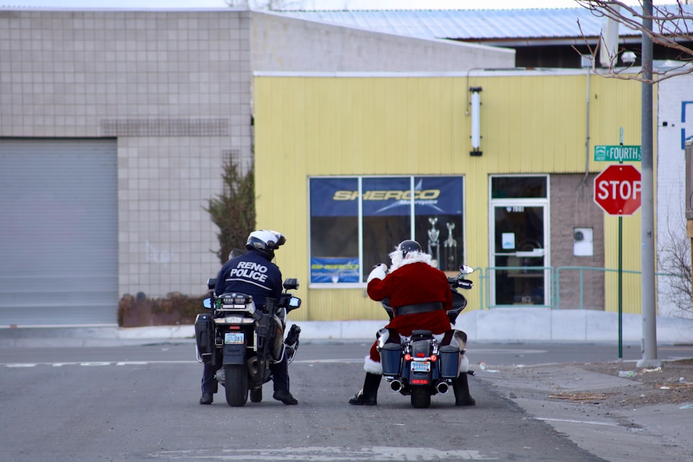 2 men riding motorcycle on road during daytime