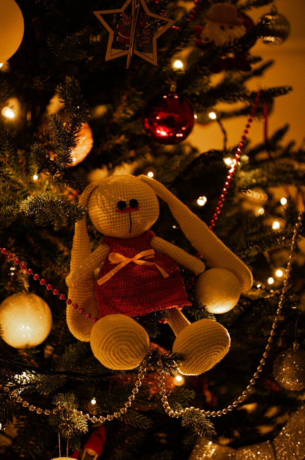 white bear plush toy on christmas tree