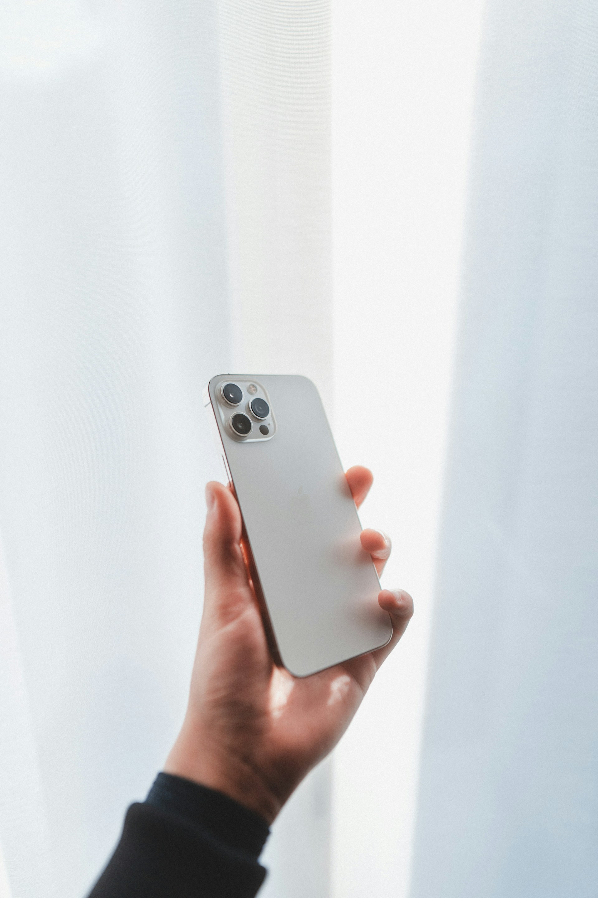 person holding silver iphone 6