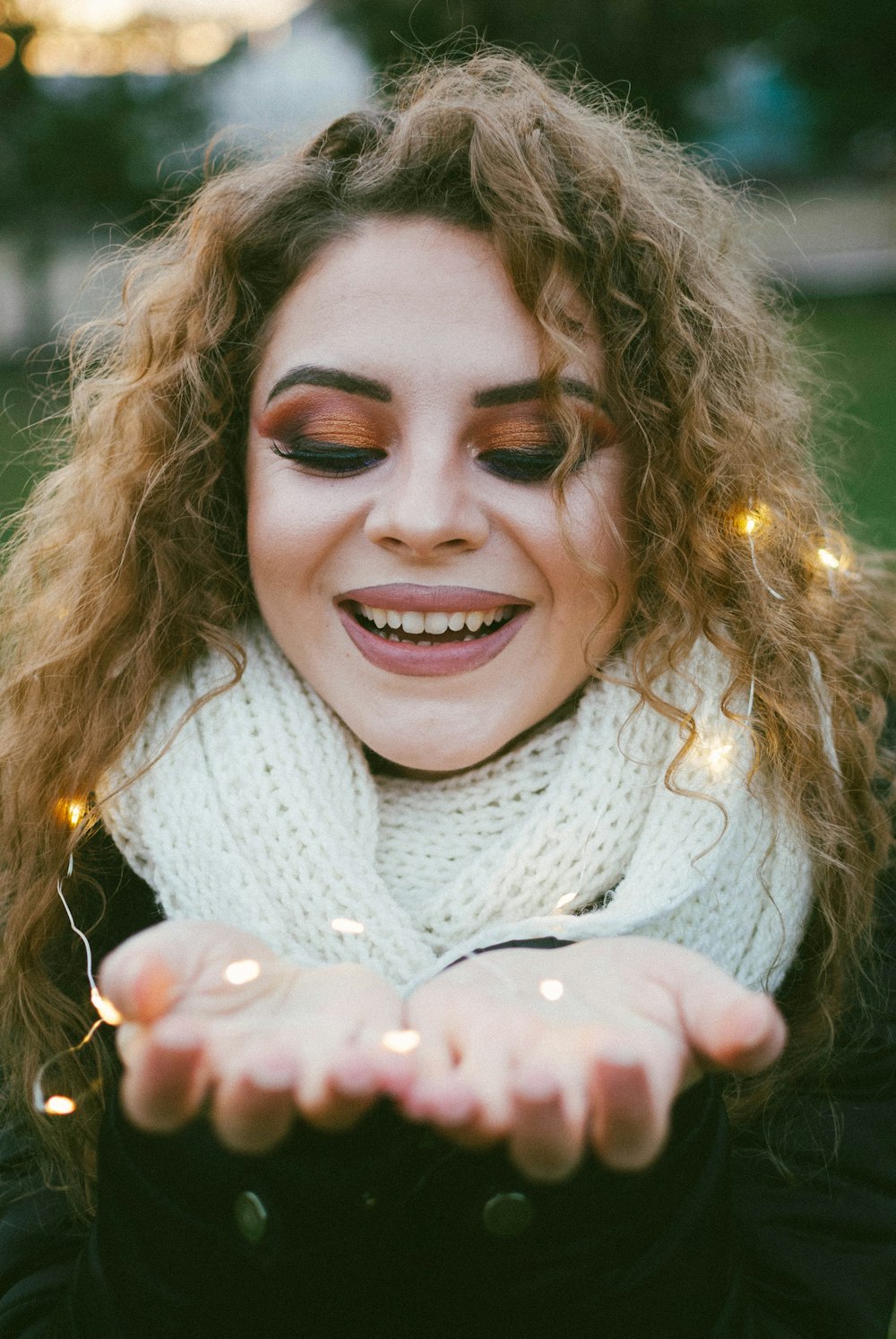 smiling woman in white scarf