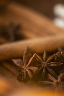 A close-up of aromatic star anise and bay leaves arranged beautifully.