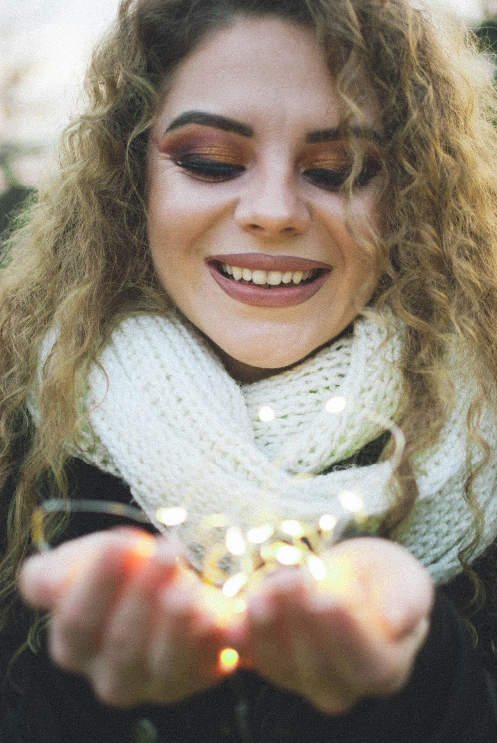 woman in white scarf smiling