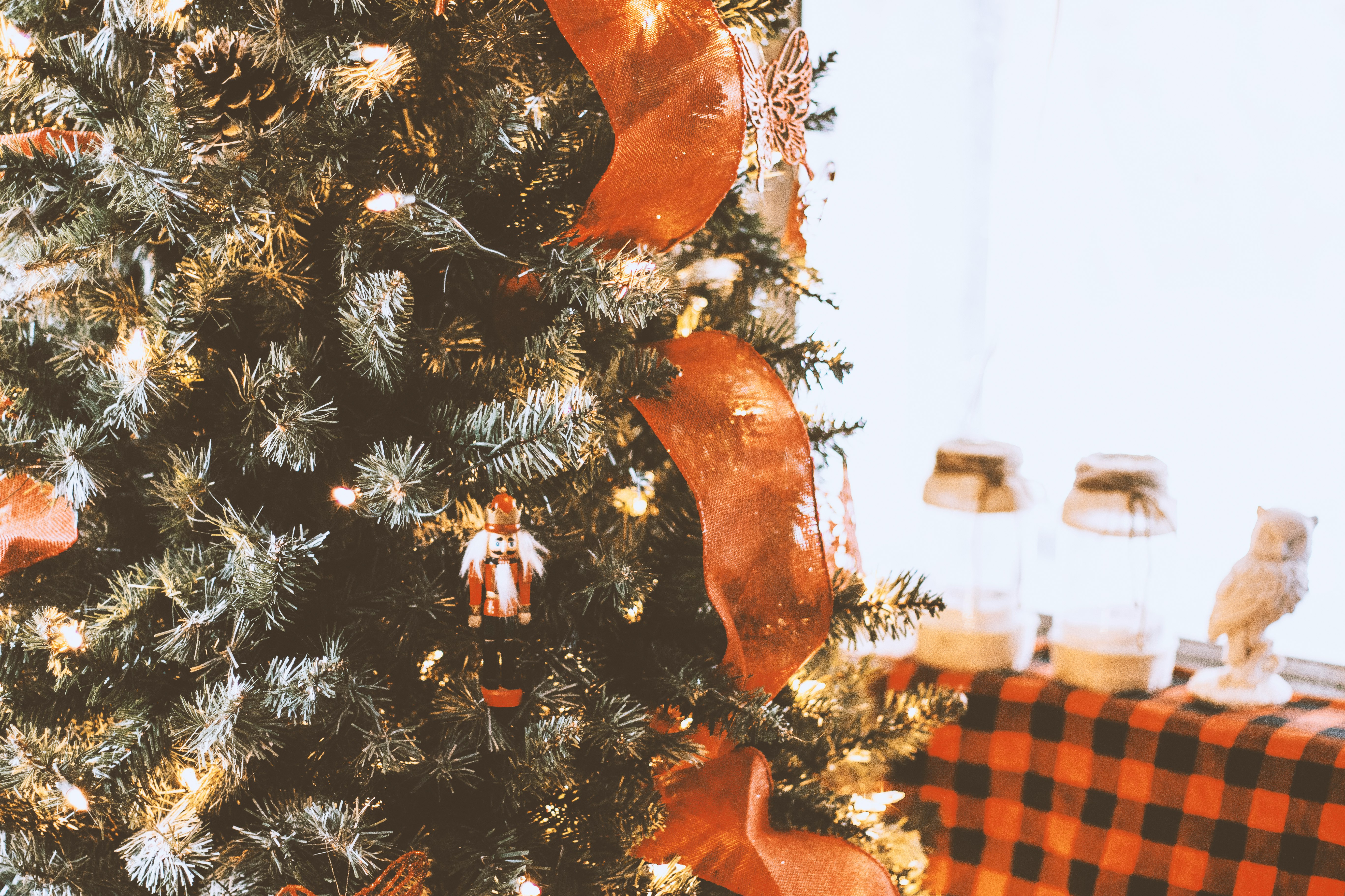 green christmas tree with orange and white star decors