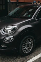 black car with silver 5 spoke wheel