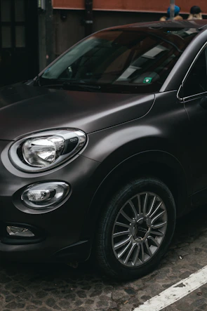 black car with silver 5 spoke wheel