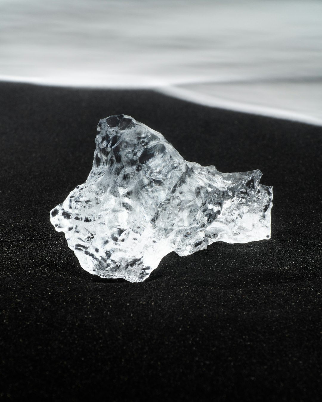 white and brown stone on white sand