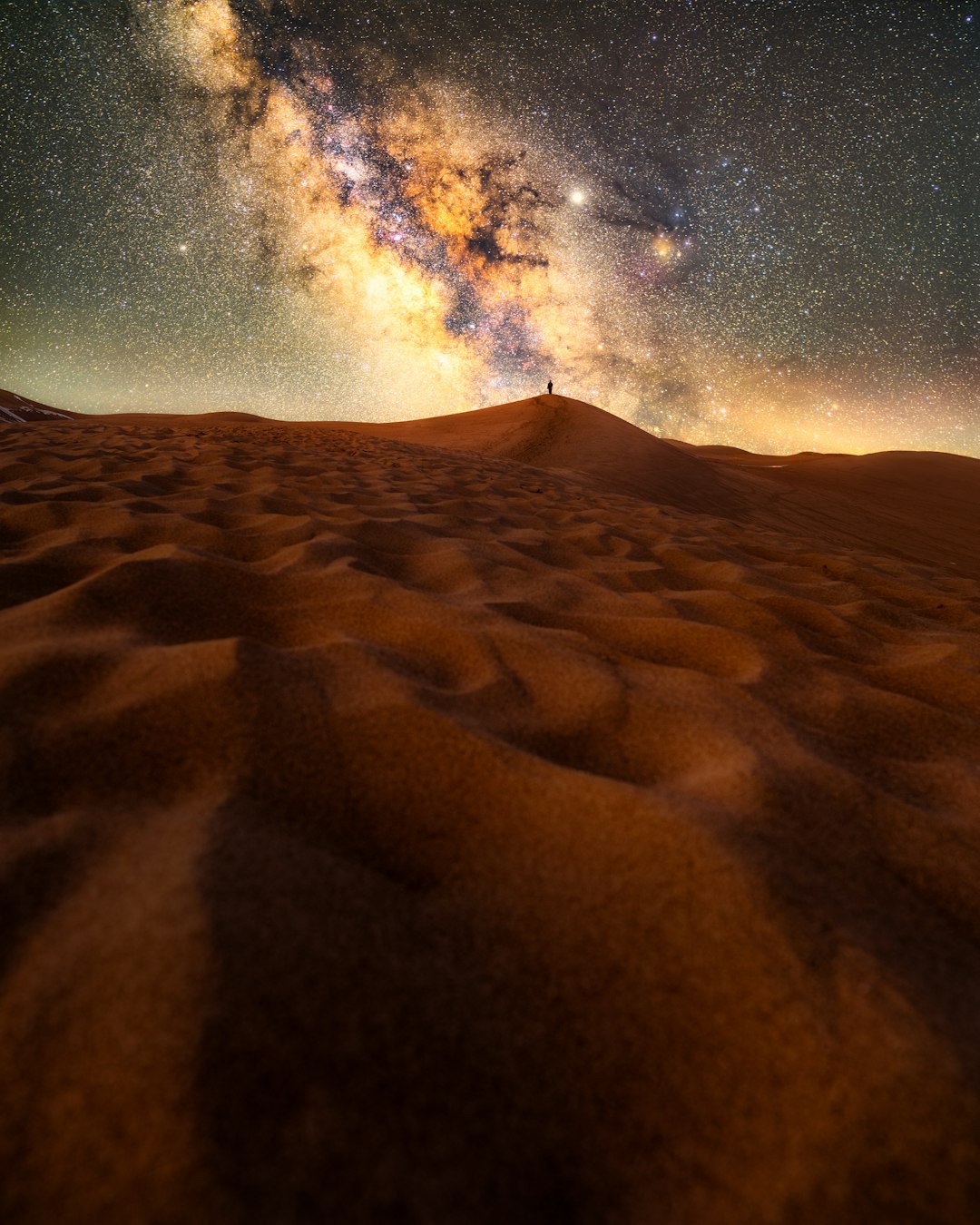 brown sand under blue sky