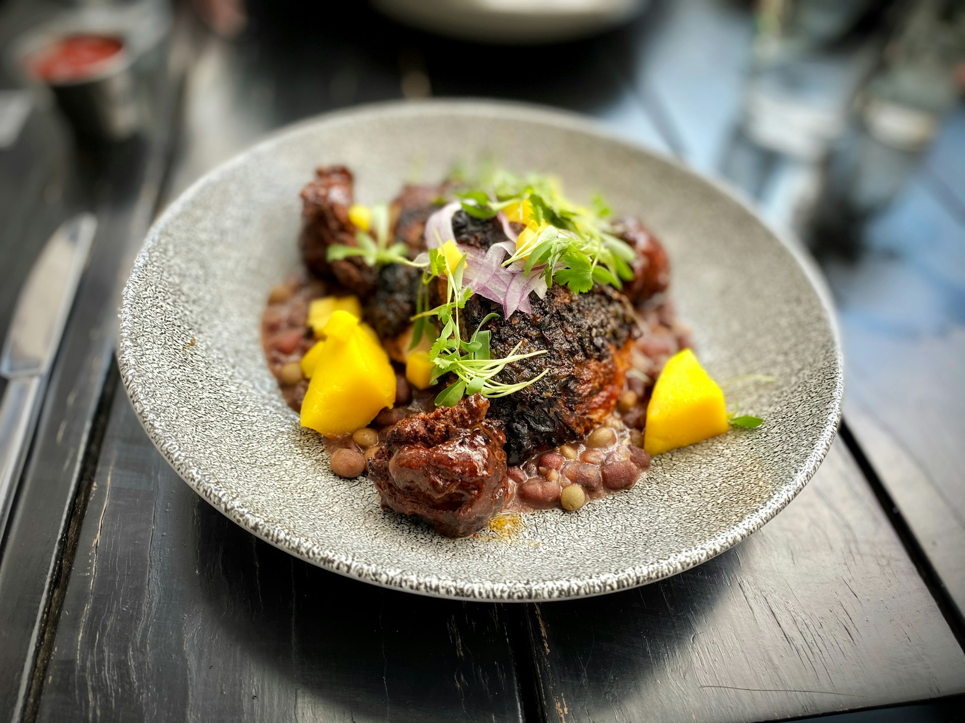 woman wearing yellow long-sleeved dress under white clouds and blue sky during daytime
