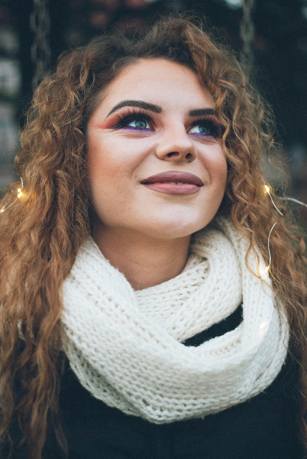 woman in white scarf smiling