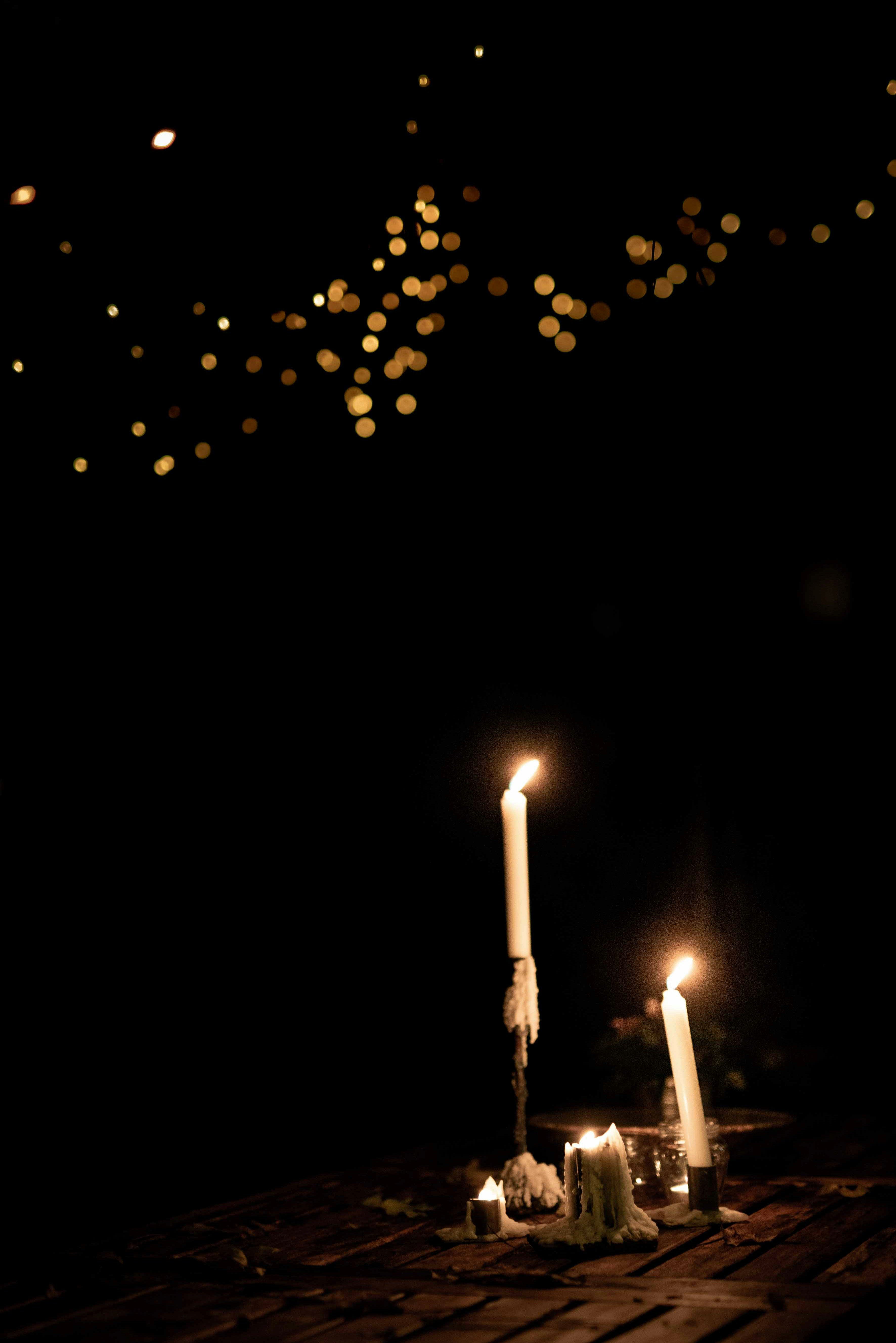 lighted candles in the dark